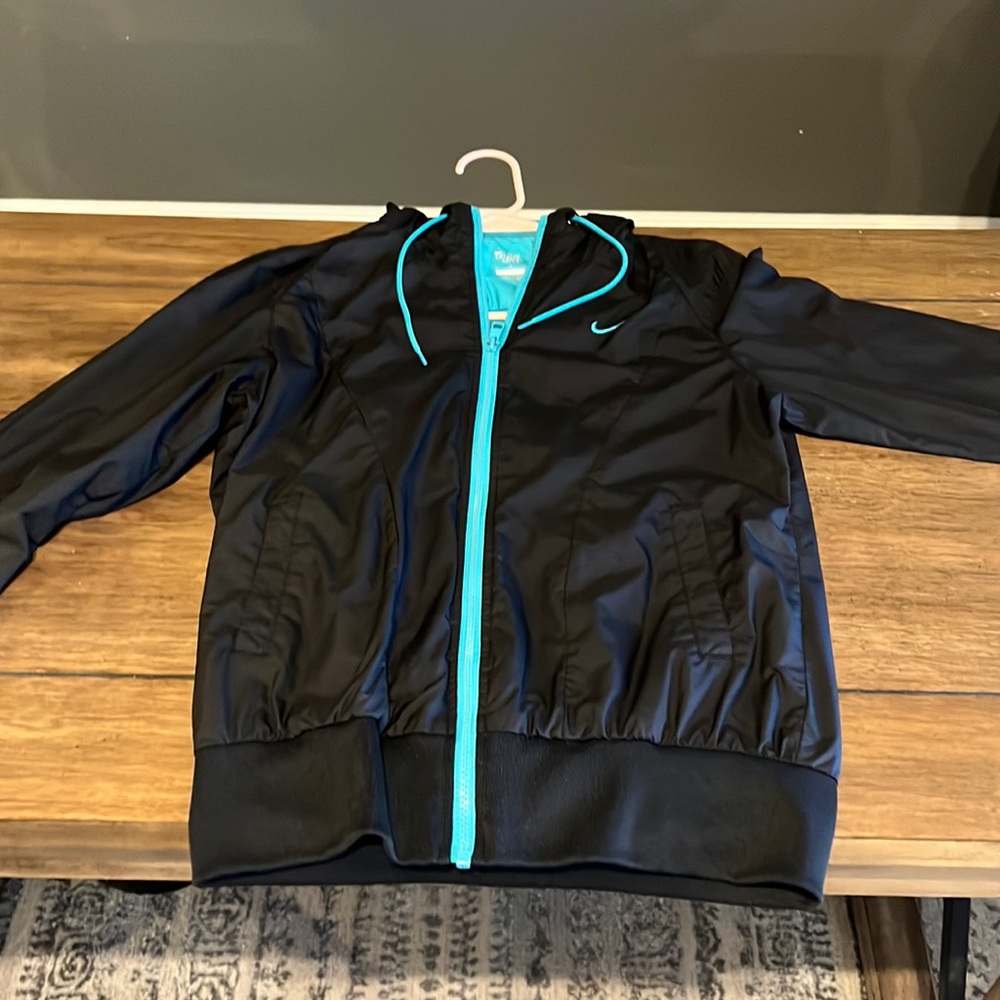 Women’s Medium Nike Zip up hoodie.